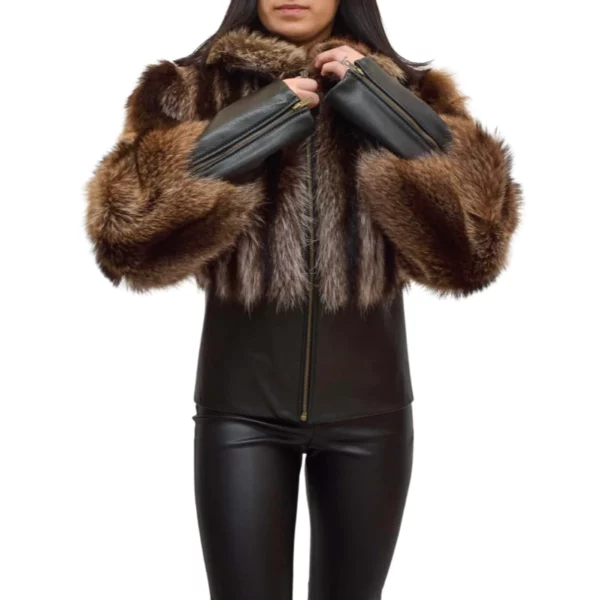 Woman zipping her racoon fur and leather coat