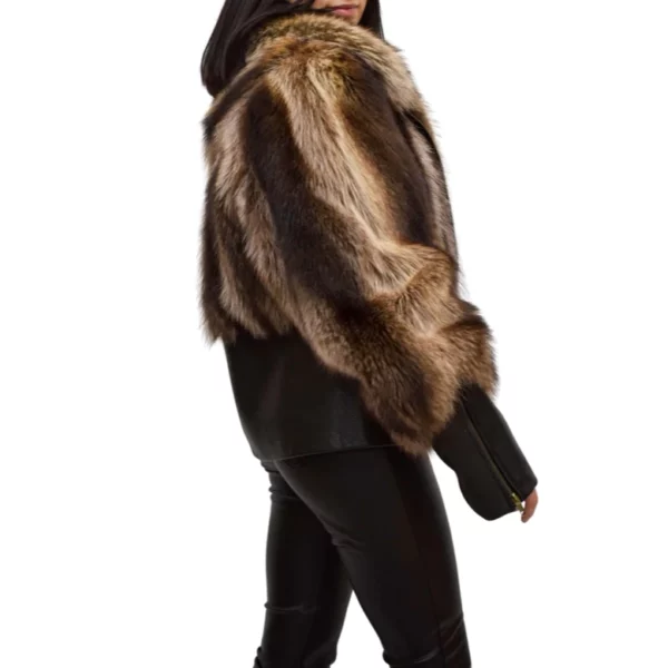 Woman wearing a raccoon fur and leather jacket
