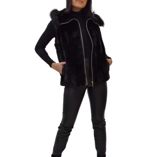 Woman posing while wearing a black mink vest