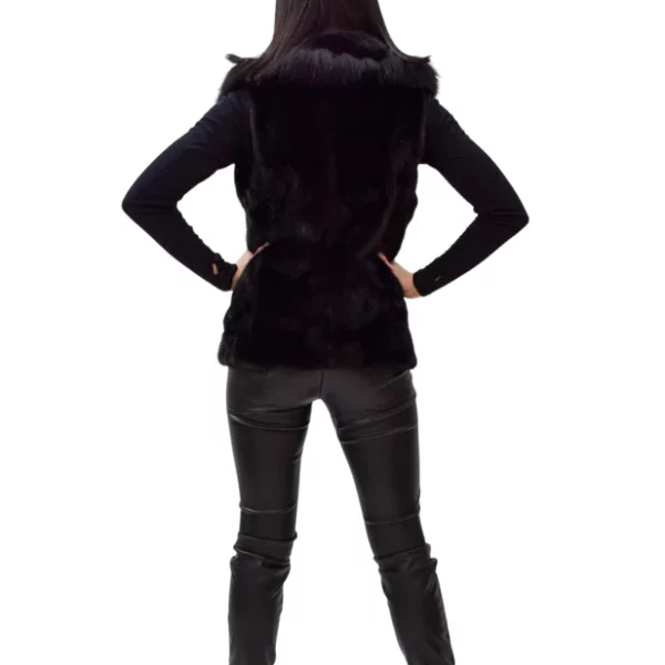 Rear view of a woman wearing a black mink vest