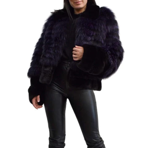 Woman wearing a purple jacket that is made with mink and fox fur