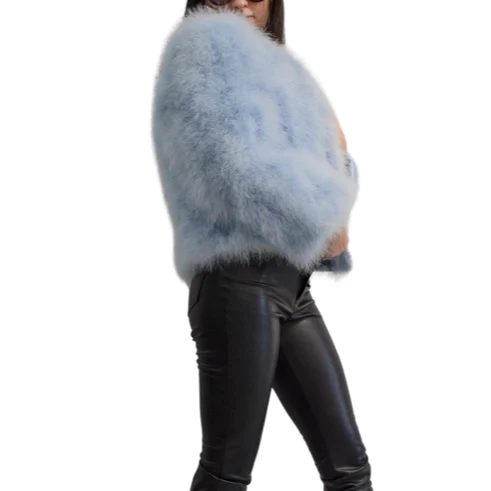 Woman wearing a blue ostrich jacket