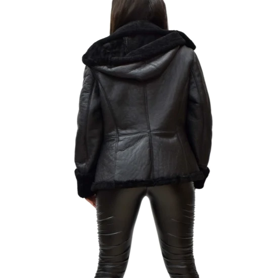 Woman facing away wearing a black leather jacket