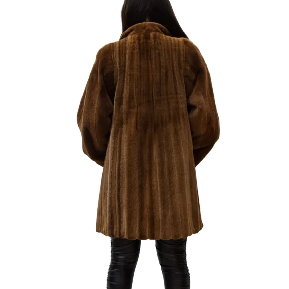 Woman wearing a mink fur stroller viewed from behind