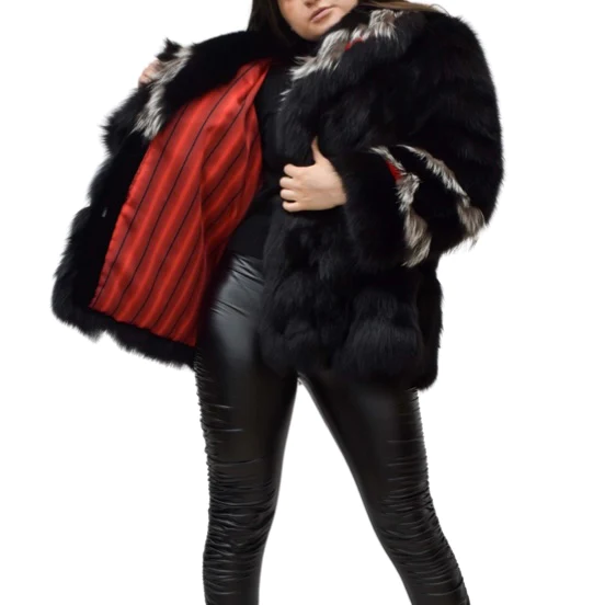Woman showing off the red lining inside her black fox fur jacket