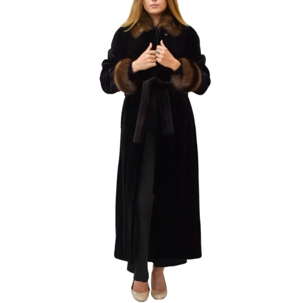 Woman holds the seams of her mink fur coat
