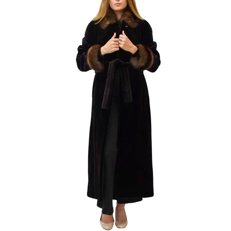 Woman holds the seams of her mink fur coat