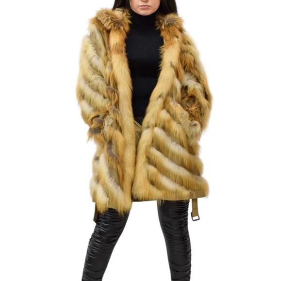 Woman wearing a stylish fox fur raincoat