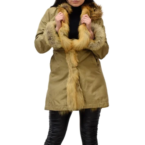 Woman wearing a gold raincoat with fox fur lining