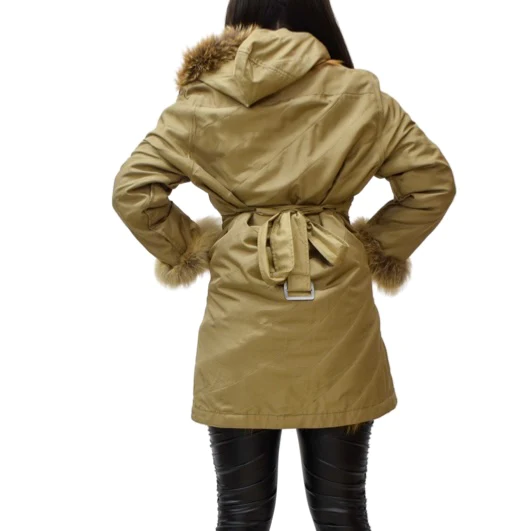 Woman wearing a gold raincoat with fox trim