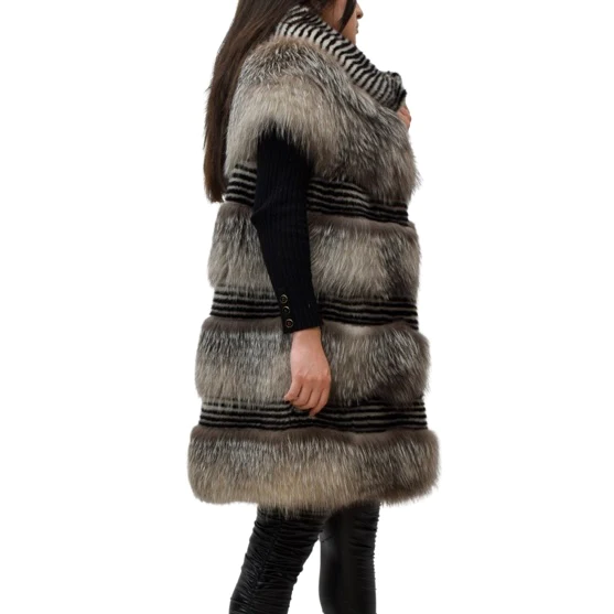 Side view of a woman wearing a mink fur vest with fox fur features