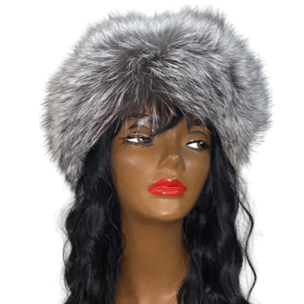 A mannequin wearing a white fox fur headband
